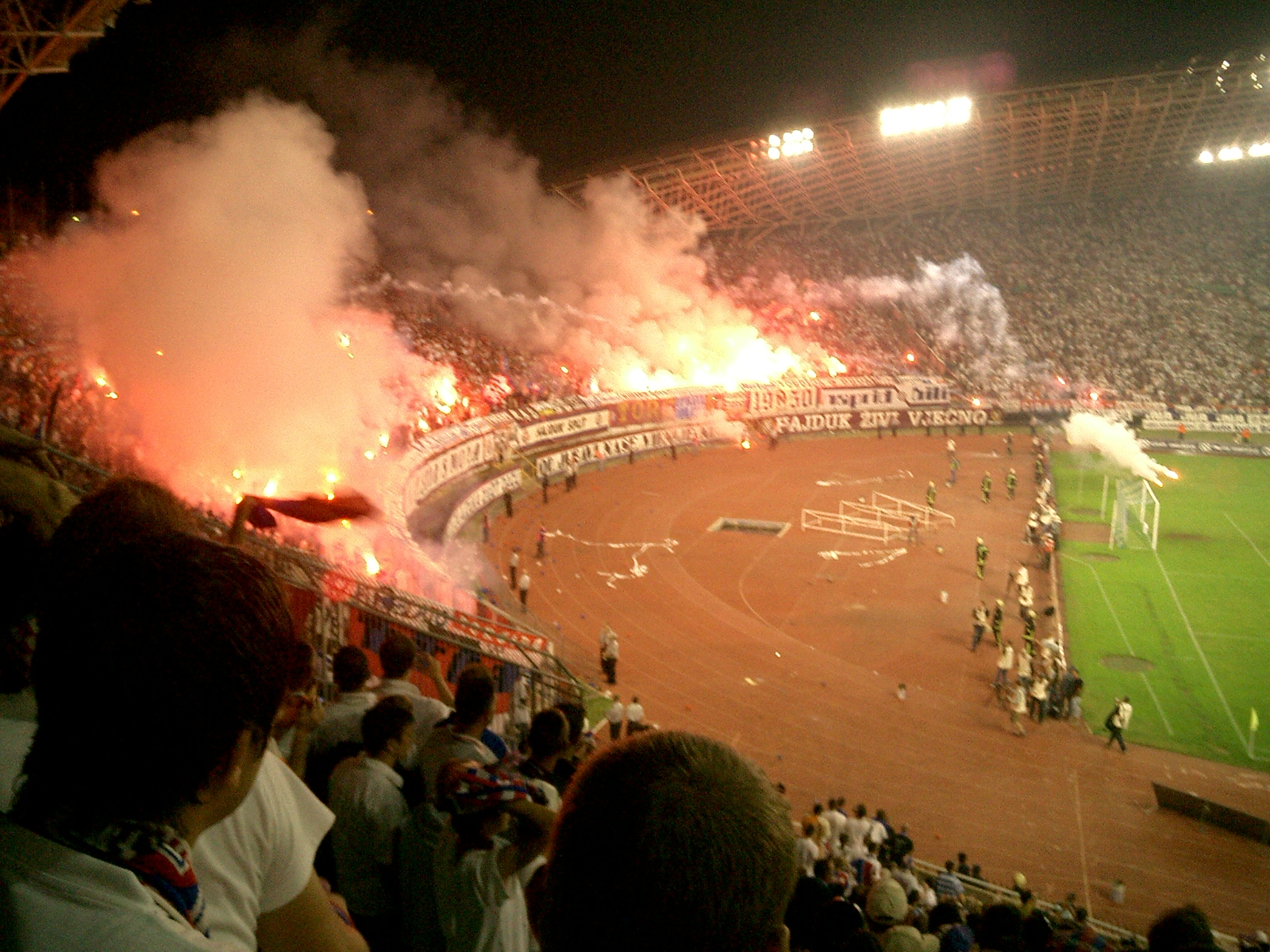 Supporters and flares during a Hajduk Split versus Dinamo Zagreb derby at Poljud